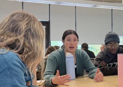 faculty members talking at a Teaching and Learning Symposium
