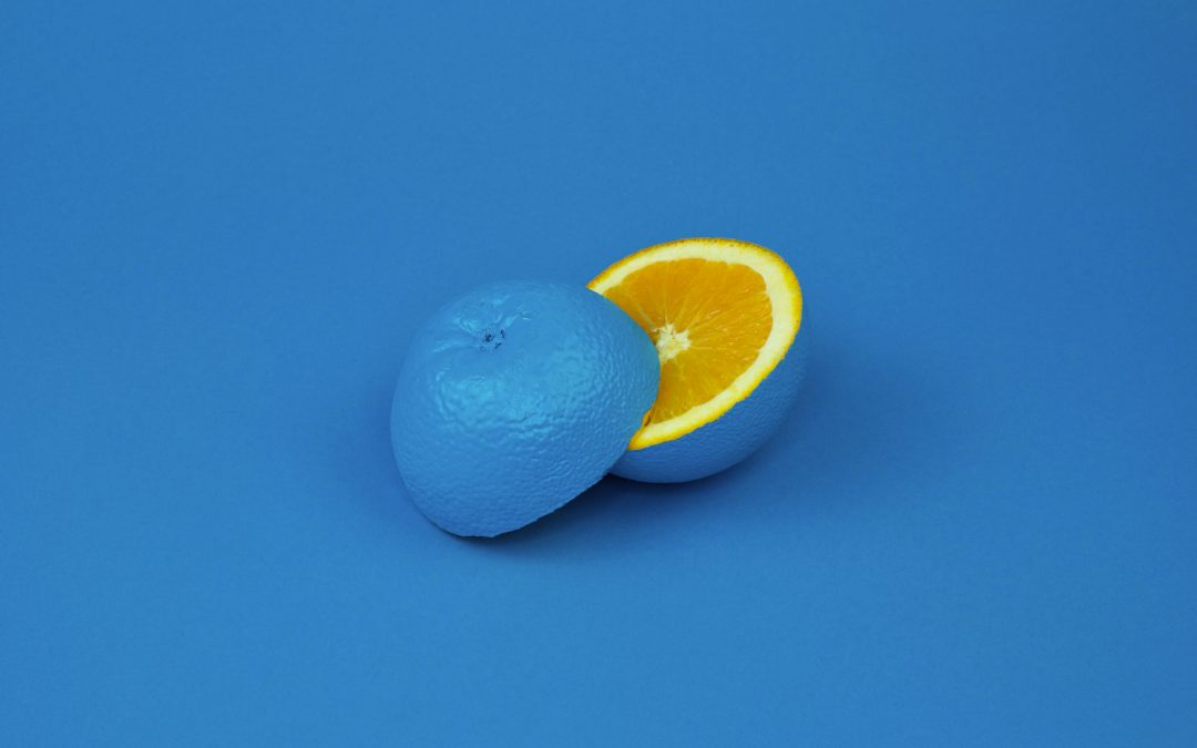 an illustration of contrast showing an orange on a blue background